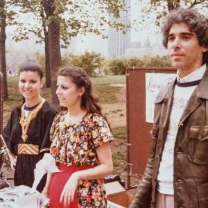 A group of people standing around a table.
