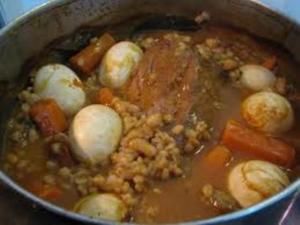A pot of stew with meat and vegetables.