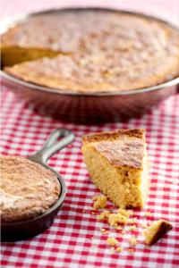 Cornbread slices on a red checkered tablecloth.