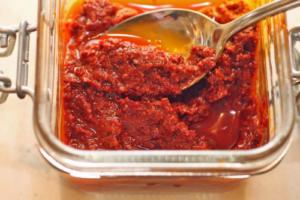 Spicy red paste in a glass jar.