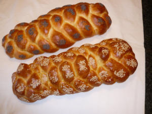 Two braided breads with poppy and sesame.