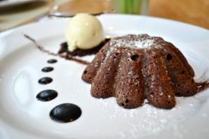 Chocolate dessert with ice cream and sauce.