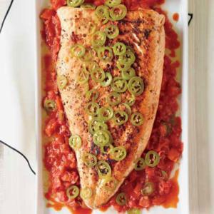 Grilled fish with jalapeños and tomato sauce.