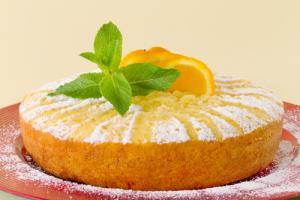 Orange sponge cake with mint garnish