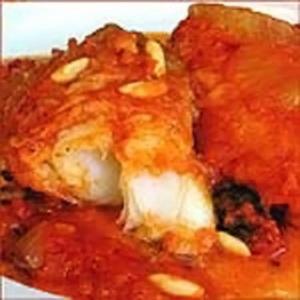 Flaky fish fillet in tomato sauce