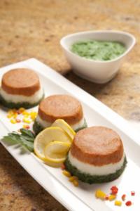 Gourmet appetizers with spinach dip and lemon.