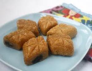 Five pastries on a light blue plate.