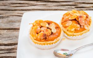 A close up of two small pies on a plate