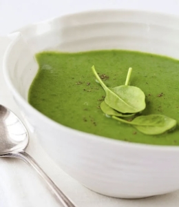 Bowl of vibrant creamy spinach soup