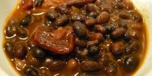 A close up of some beans and meat