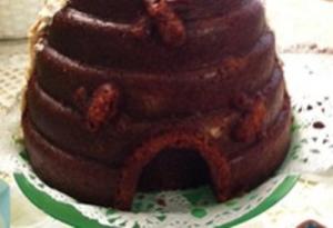 A close up of a chocolate cake with some type of candy on top