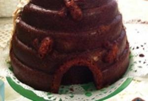 A close up of a chocolate cake with bacon on top