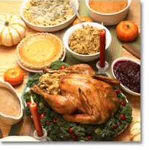 Thanksgiving dinner with turkey and side dishes.