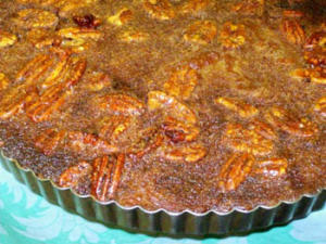 Pecan pie in a round baking dish.