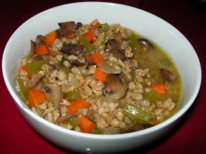 A bowl of stew with meat and vegetables.