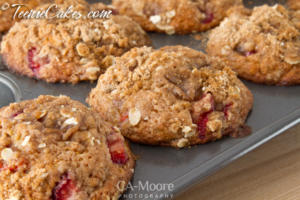 Strawberry muffins in a baking tray.