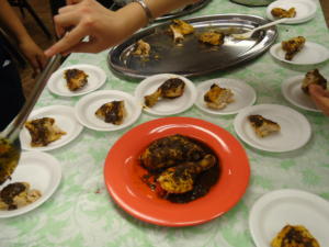 Serving plates of seasoned roasted chicken.