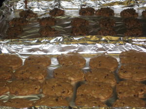 Chocolate chip cookies on foil baking sheets