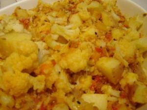 Spicy cauliflower and potato curry in bowl.