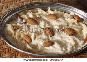 A bowl of food with almonds on top.
