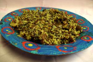 Quinoa dish on colorful decorative plate.