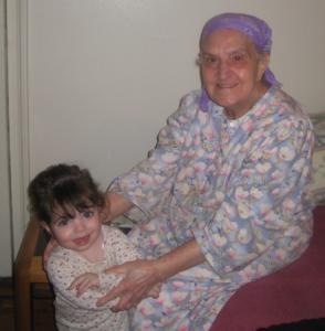 A woman and child sitting on the floor.