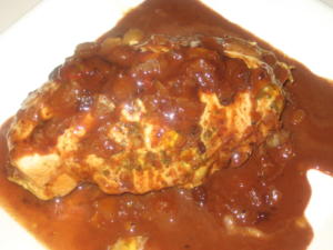 Stuffed chicken breast with rich brown sauce.