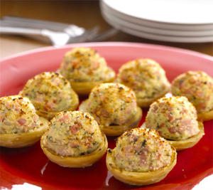 Stuffed artichokes on a red plate.