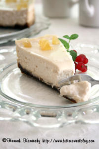 Cheesecake slice with fruit garnish on plate.