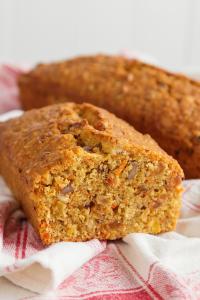 Sliced carrot walnut loaf on tea towel