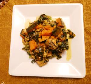 Vegetable dish on a white square plate.