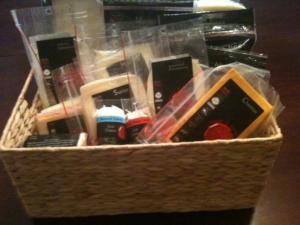 Basket filled with assorted packaged cheeses.