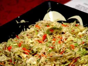 Cabbage coleslaw with carrots on a plate.