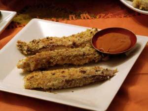 Breaded fish sticks with dipping sauce.