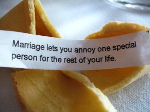 A fortune cookie with the message " marriage lets you annoy one specie. Person for the rest of your life ".