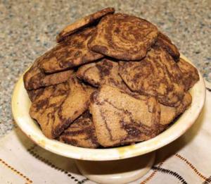 Bowl of marbled cookies on a counter.