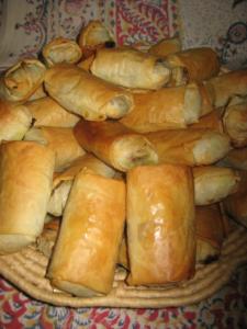 Basket of golden-brown stuffed pastries.