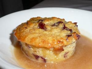 Bread pudding in a white bowl.