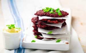 A stack of red velvet cookies on top of each other.
