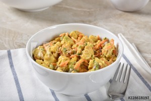 Bowl of curried chicken salad with vegetables