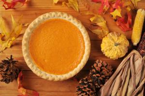 A pie with pumpkin in it on top of a table.