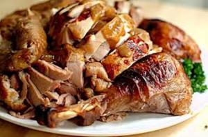Sliced roasted turkey on serving platter