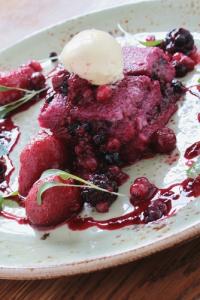 A plate of food with fruit on it.