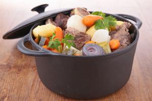 A pot of stew with meat and vegetables in it.