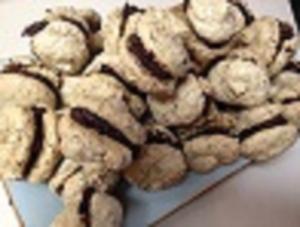 Cookies with chocolate filling on a plate.