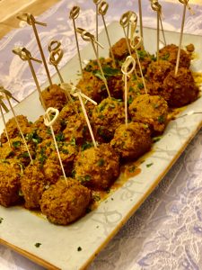 A plate of food with some type of meat on it