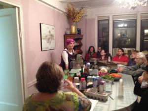 Instructor leading intimate home cooking class