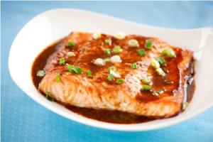 Teriyaki salmon fillet garnished with green onions