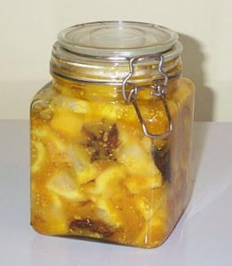 A jar of pineapple chunks on the counter.