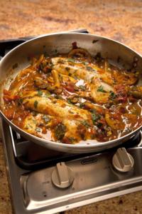Skillet fish fillets in tomato-onion sauce